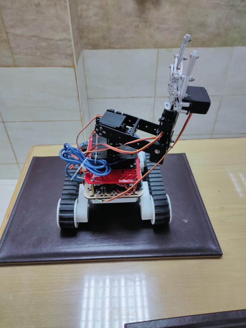 Unmanned vehicle with robotic arm