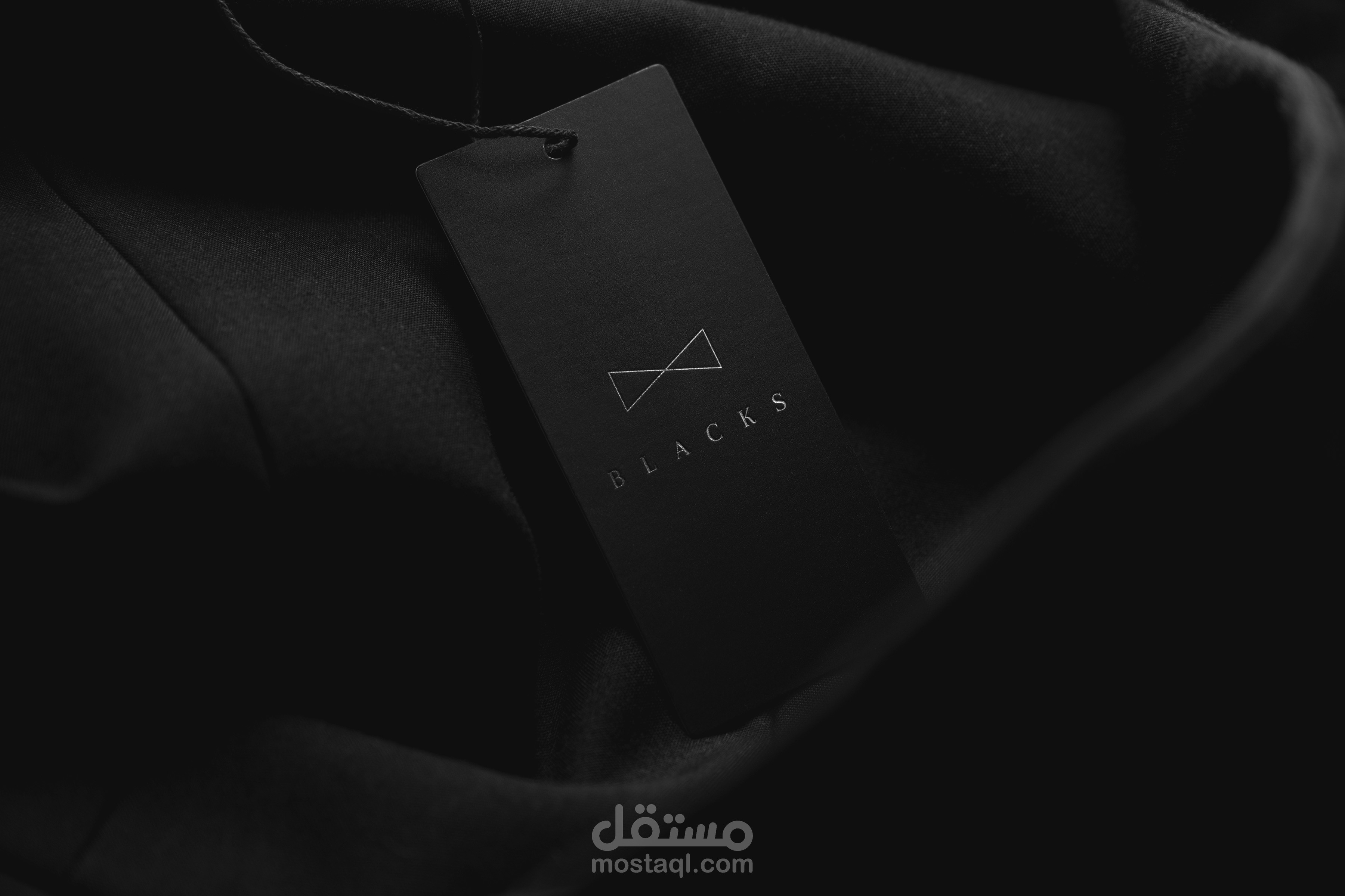 logo for "BLACKS" suits house