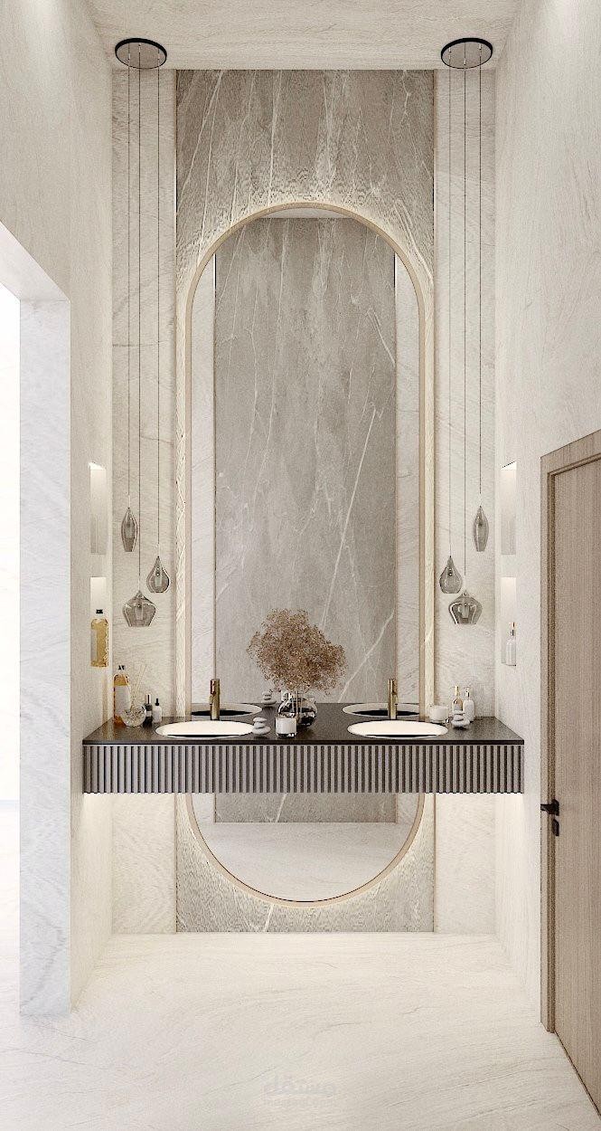 اقتراحين محتلفين لتصميم دورات مياه بتفاصيل داكنة ولمسات معمارية جريئة تعكس فخامة الطراز العصري