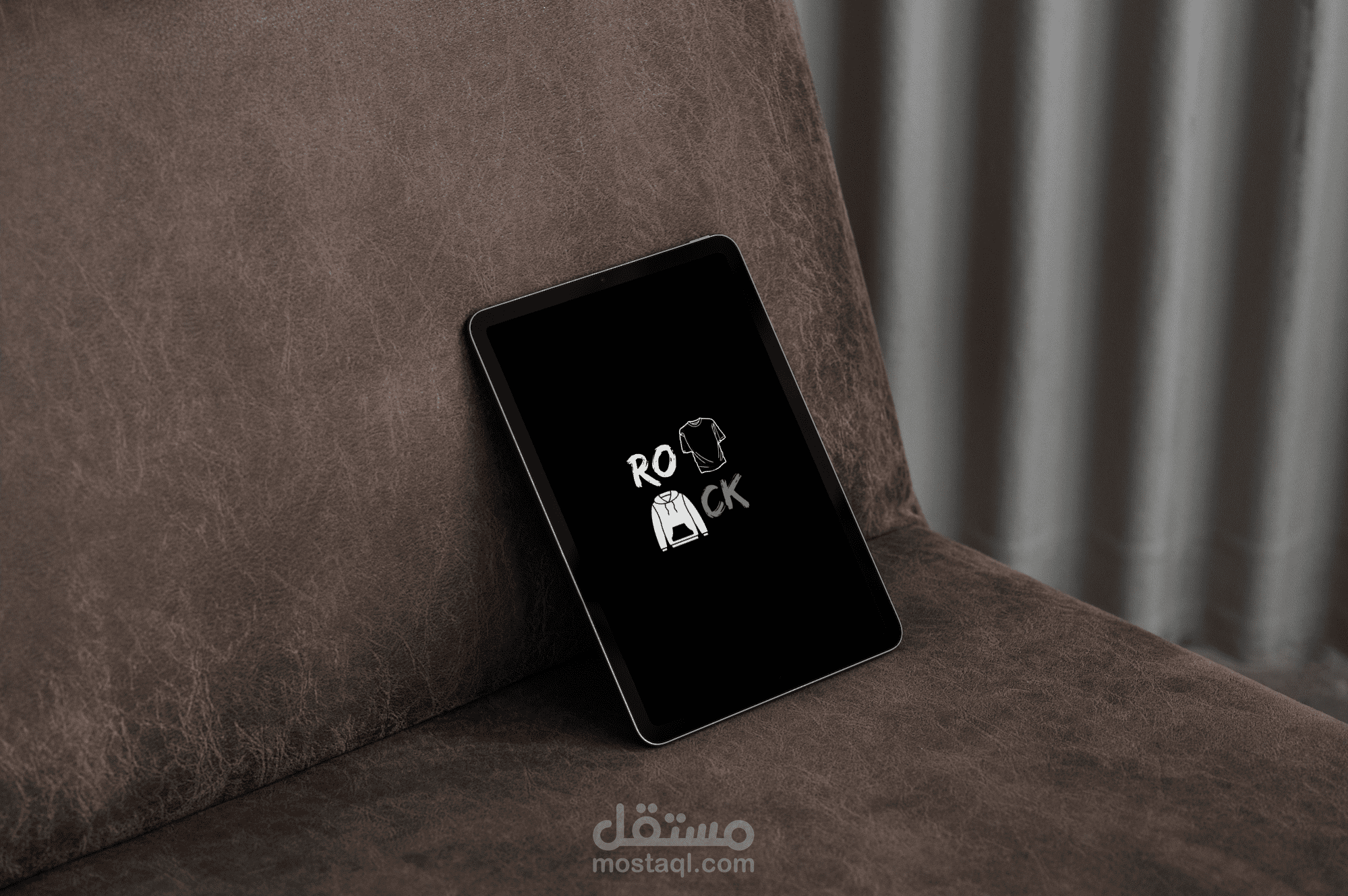 شعار لمحل ملابس اسمه ROCK