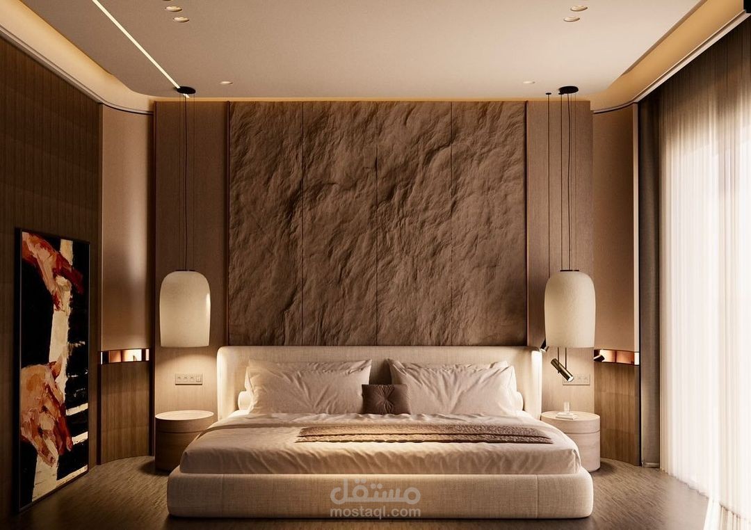 غرفة نوم حديثة مصممة بأناقة، مع إضاءة دافئة وأثاث فاخر، حيث يتميز التصميم بمزيج متناغم بين الراحة والأناقة