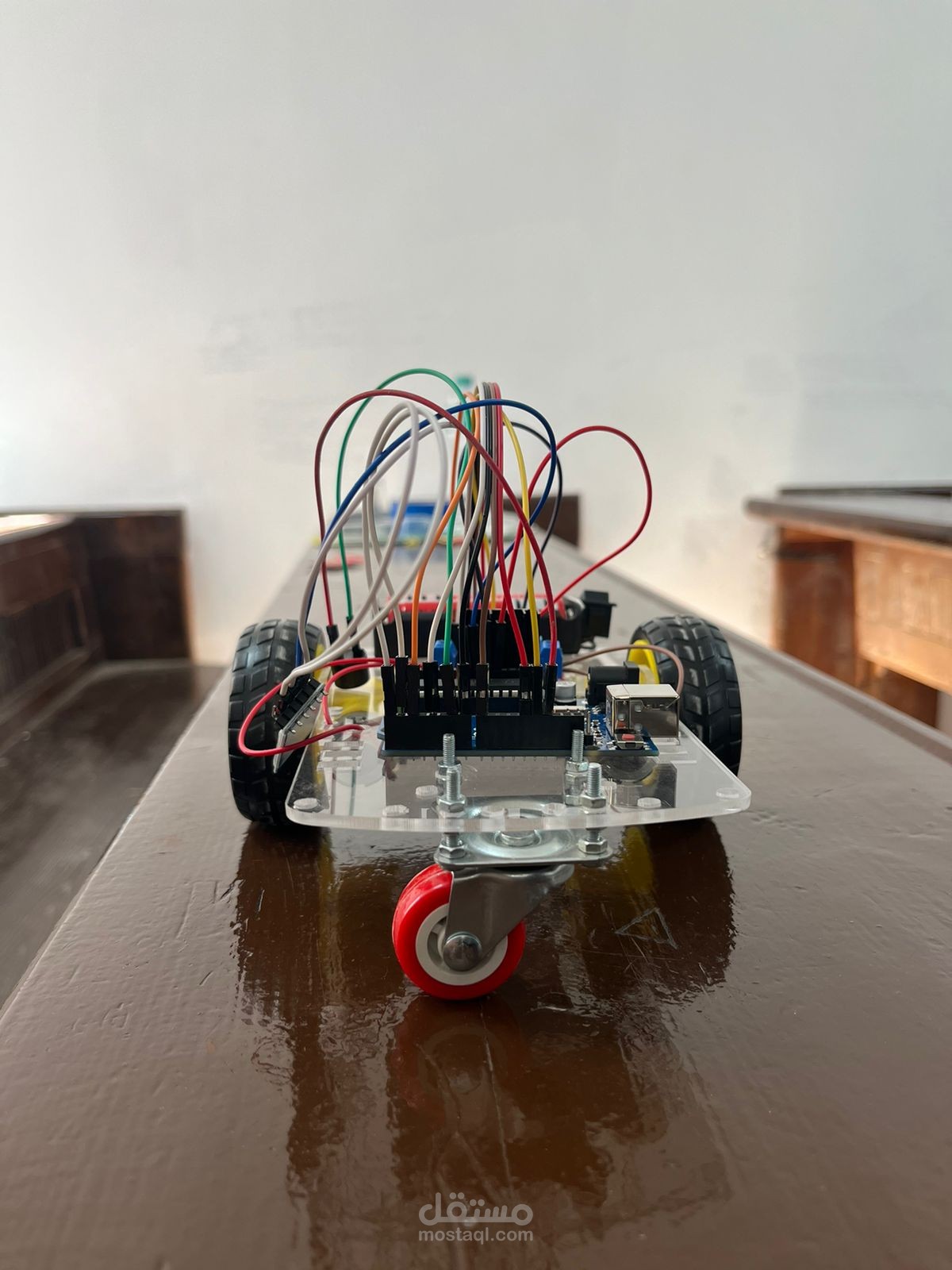 Bluetooth-controlled car featuring obstacle detection, lights, and a buzzer